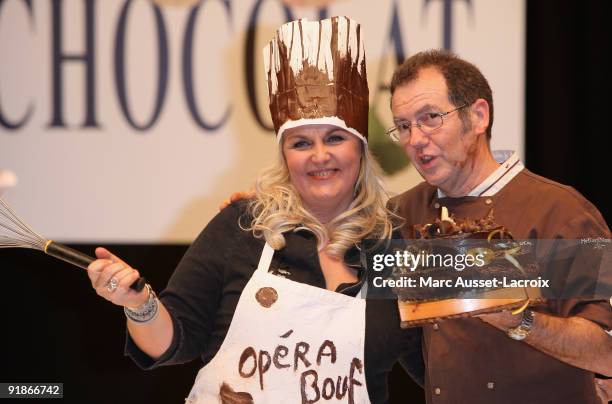 Valerie Damidot and guest displays a chocolate decorated dress during the Chocolate dress fashion show celebrating Salon Du Chocolat 15th Anniversary...