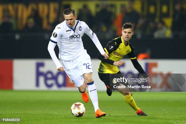 Josip Ilicic of Atalanta and Julian Weigl of Borussia Dortmund during UEFA Europa League Round of 32 match between Borussia Dortmund and Atalanta...