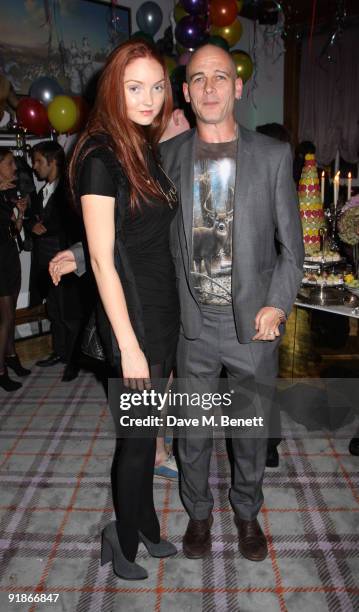 Lily Cole and Dinos Chapman attend the Juicy Couture VIP launch party on October 13, 2009 in London, England.