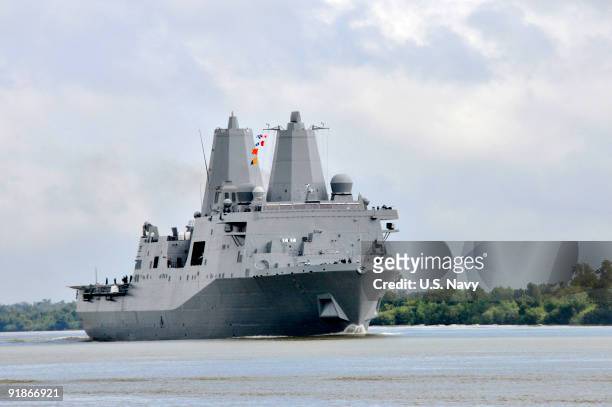 In this photo provided by the U.S. Navy, the amphibious transport dock ship Pre-Commissioning Unit New York transits the Mississippi River, after...