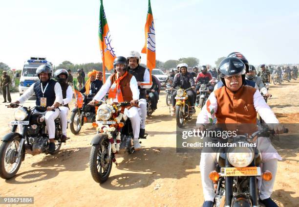 President Amit Shah riding pillion with BJP State President Subhash Barala on a motorcycle, on the way to venue of rally organised on February 15,...