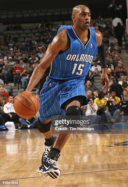 Vince Carter of the Orlando Magic moves the ball against the Dallas Mavericks during the preseason game at the American Airlines Center on October 5,...