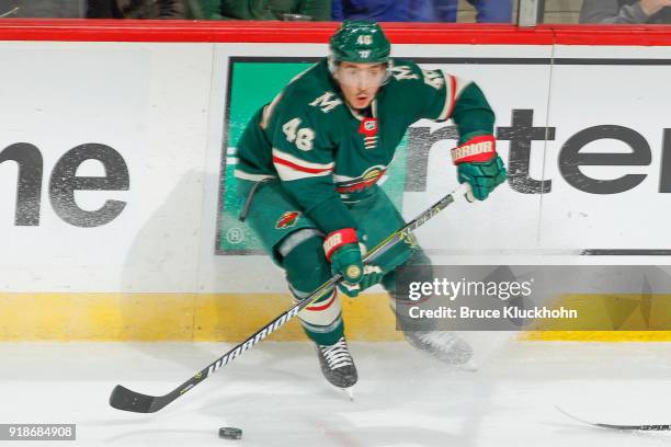 Jared Spurgeon of the Minnesota Wild handles the puck against the Chicago Blackhawks during the game at the Xcel Energy Center on February 10, 2018...