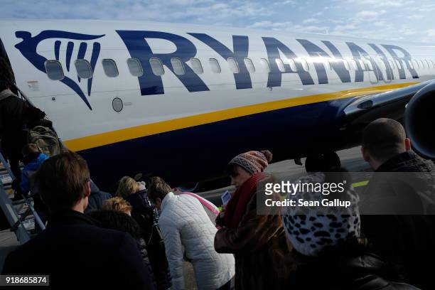 Passengers board a Ryanair flight at Schoefeld Airport near Berlin on February 15, 2018 Schoenefeld, Germany. Ryanair is expanding its routes network...