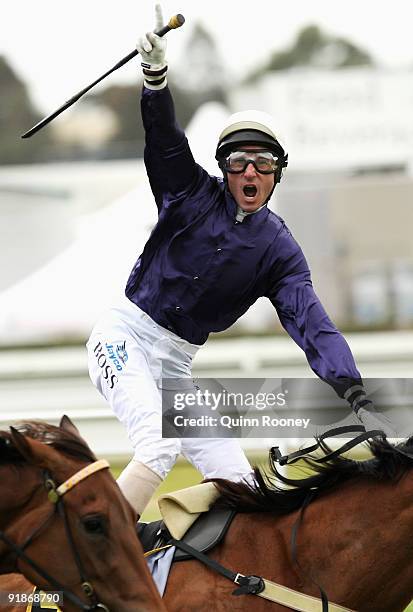 Glen Boss riding Irish Lights celebrates winning the Schweppes Thousand Guineas during the Thousand Guineas Day meeting at Caulfield Racecourse on...