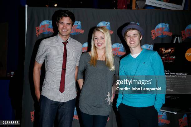 Drew Seeley, Adrian Slade and Lucas Grabeel visit Planet Hollywood on October 13, 2009 in New York City.