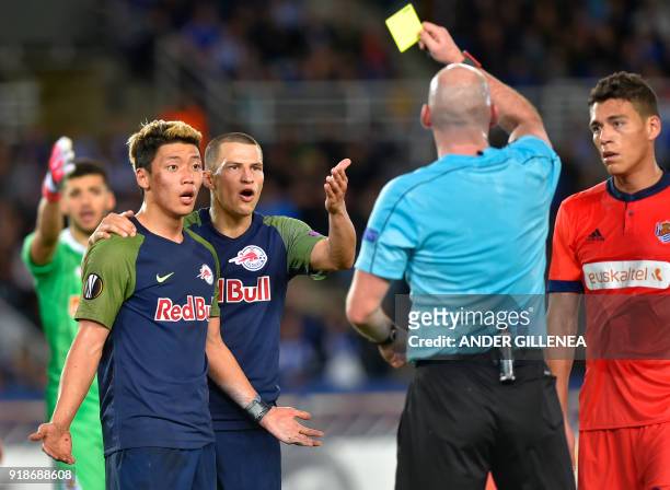 The referee shows a red card to FC Salzburg's South Korean forward Hwang Hee-Chan during the UEFA Europa League first leg round of 32 football match...