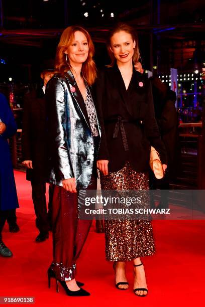 German actresses Lavinia Wilson and Sina Tkotsch pose on the red carpet upon their arrival at the Berlinale Palace for the opening ceremony of the...