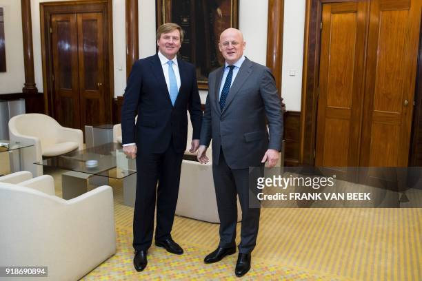 King Willem-Alexander of The Netherlands poses with Dutch Minister of Justice and Security Ferdinand Grapperhaus , prior to their meeting at the...
