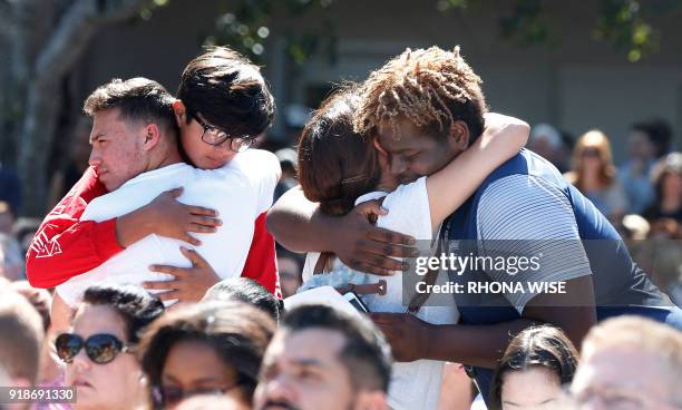 Mourners hug during a prayer vigil for the victims of the Marjory Stoneman Douglas High School shooting at Parkridge Church in Coral Springs, Florida...