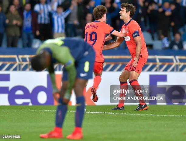 Real Sociedad's Spanish defender Alvaro Odriozola celebrates a goal with Real Sociedad's Spanish midfielder Xabier Prieto during the UEFA Europa...