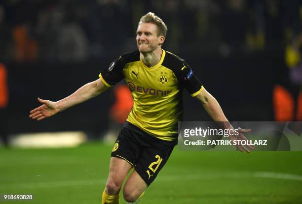 Dortmund's German midfielder Andre Schuerrle celebrates after scoring the 1-0 during the UEFA Europa League round of 32, first leg football match of...