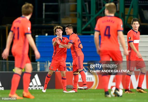 Real Sociedad's Spanish defender Alvaro Odriozola celebrates a goal with Real Sociedad's Mexican defender Hector Moreno during the UEFA Europa League...