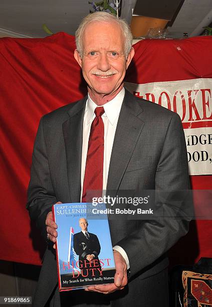 Captain Chesley Sullenberger attends a signing session to promote his book "Highest Duty" at Bookends on October 13, 2009 in Ridgewood, New Jersey.