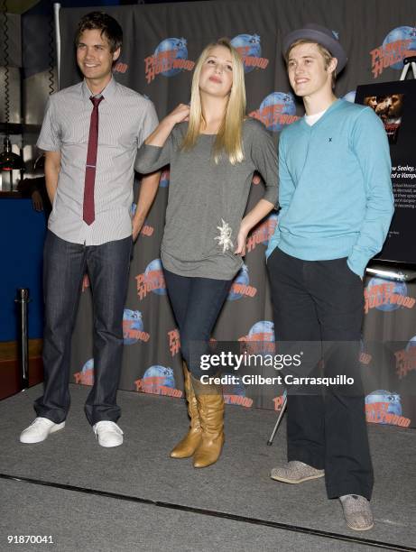 Drew Seeley, Adrian Slade and Lucas Grabeel visit Planet Hollywood on October 13, 2009 in New York City.