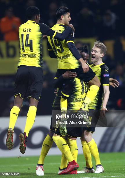 Michy Batshuayi of Borussia Dortmund celebrates scoring the third Borussia Dortmund goal with team mates during UEFA Europa League Round of 32 match...