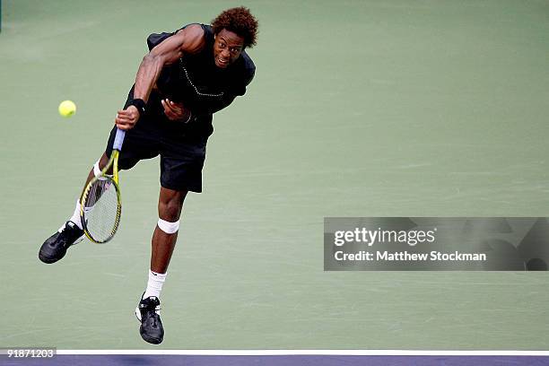 Gael Monfils of France serves to Lleyton Hewitt of Australia during the 2009 Shanghai ATP Masters 1000 at Qi Zhong Tennis Centre on October 14, 2009...