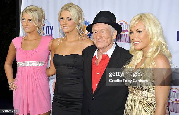 Hugh Hefner and The new girls next door pose for a picture at the 2009 Fox Reality Channels Really Awards held at The Music Box @ Fonda on October...