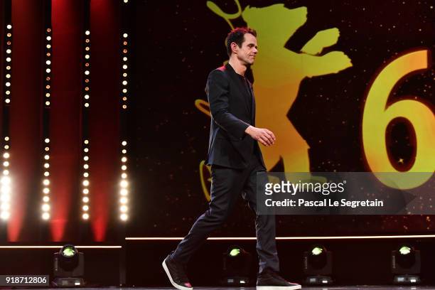 Jury President Tom Tykwer enters the stage at the Opening Ceremony & 'Isle of Dogs' premiere during the 68th Berlinale International Film Festival...