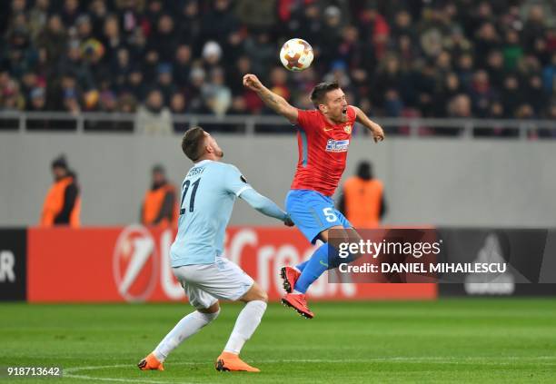 Steaua Bucharest's Romanian midfielder Mihai Pintilii and Lazio's Serbian midfielder Sergej Milinkovic-Savic vie with the ball during the UEFA Europa...