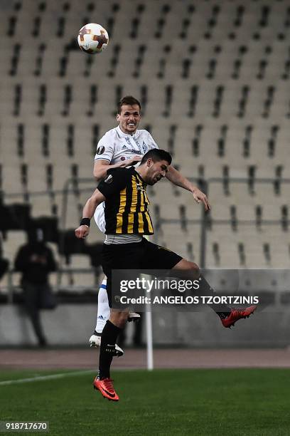 S Michalis Bakasetas vies for the ball with Dynamo Kiev's Tomasz Kedziora during the UEFA Europa League round of 32 football match between AEK Athens...