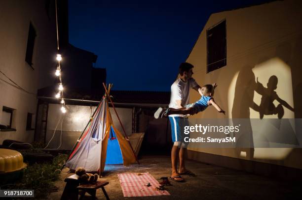 storytelling in our backyard - shadow puppets stock pictures, royalty-free photos & images