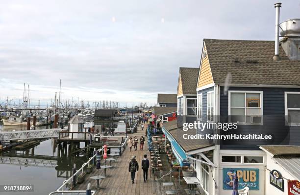 visitors explore steveston harbour, british columbia, canada - richmond british columbia imagens e fotografias de stock