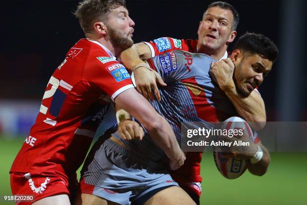 Liam Salter and Danny McGuire of Hull KR tackle Fouad Yaha of the Catalans Dragons during the BetFred Super League match between Hull KR and Catalans...