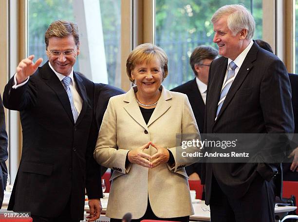 Guido Westerwelle, leader of the German Free Democrats , German Chancellor and Chairwoman of the German Christian Democrats Angela Merkel and...