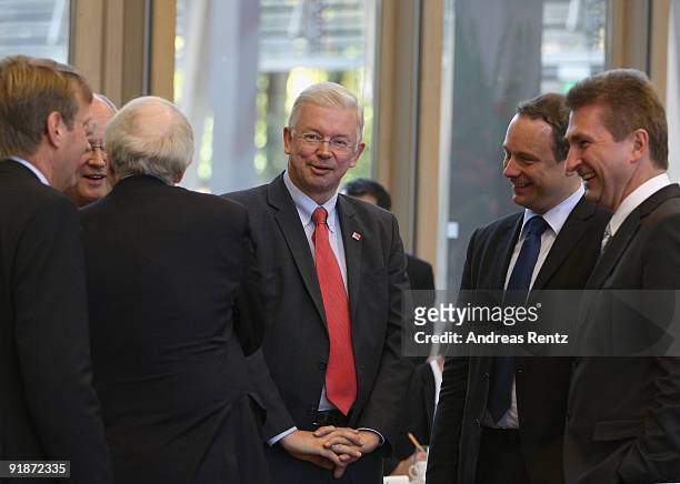 German Christian Democrat and Governor of the state of Hesse Roland Koch talks to Georg Fahrenschon and Andreas Pinkwart , Vice party leader of the...