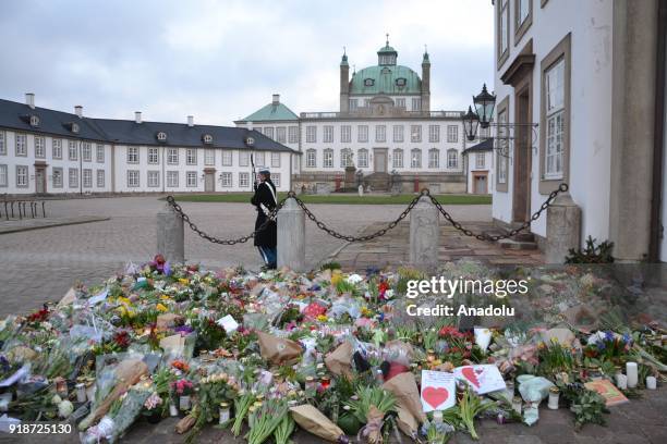 Flowers are placed in front of Fredensborg Palace after Danish Queen Margrethe's husband Prince Henrik's death announced, who passed away at the age...