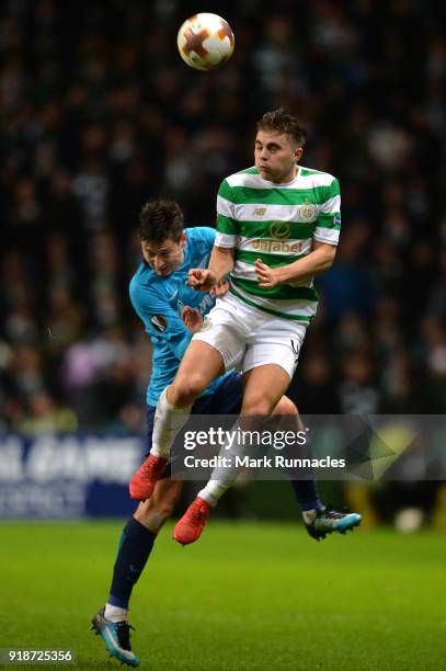 James Forrest of Celtic and Daler Kuzyayev of Zenit St. Petersburg clash during UEFA Europa League Round of 32 match between Celtic and Zenit St...