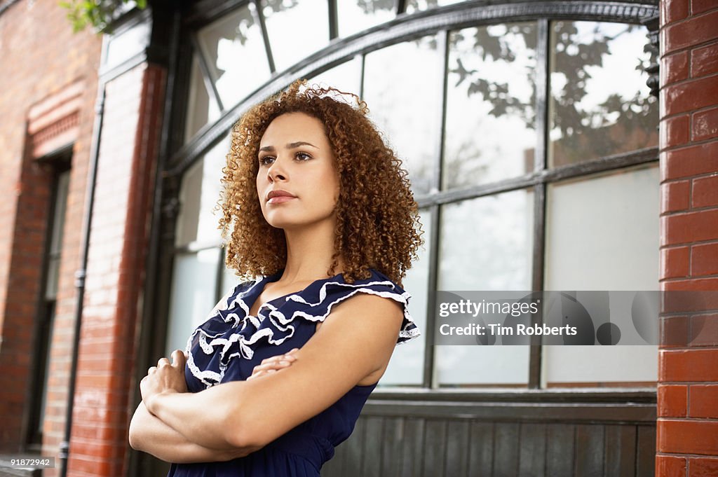 Confident young business woman outside office