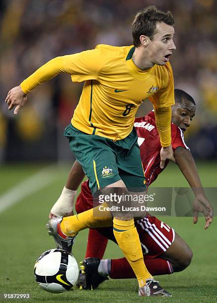 Luke Wilkshire of Australia controls the ball during the Asian Cup Group B qualifying match between the Australian Socceroos and Oman at Etihad...