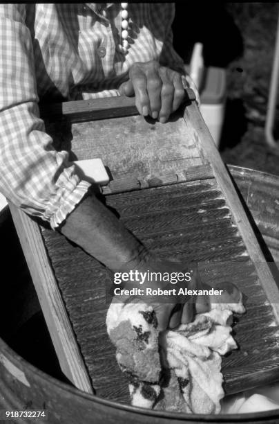 Woman demonstrates how clothes were washed in the 19th century, using a washboard and elbow grease, at the Tennessee Fall Homecoming at the Museum of...