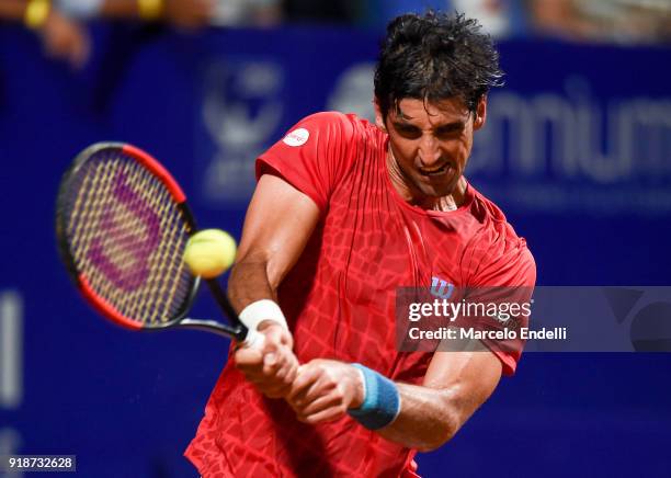 Thomaz Bellucci of Brazil takes a backhand shot during a second round match between Diego Schwartzman of Argentina and Thomaz Bellucci of Brazil as...