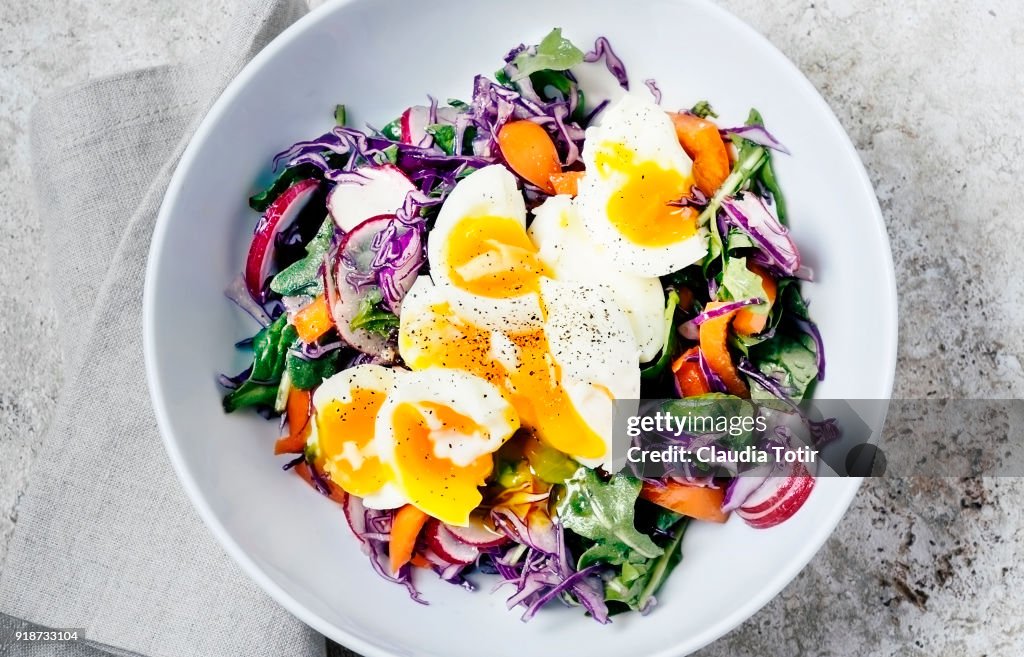 Fresh salad with soft boiled eggs