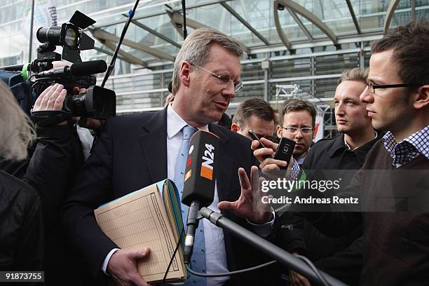 Lower Saxony Governor Christian Wulff gives a statement to journalists after the third round of coalition negotiations between the German Christian...