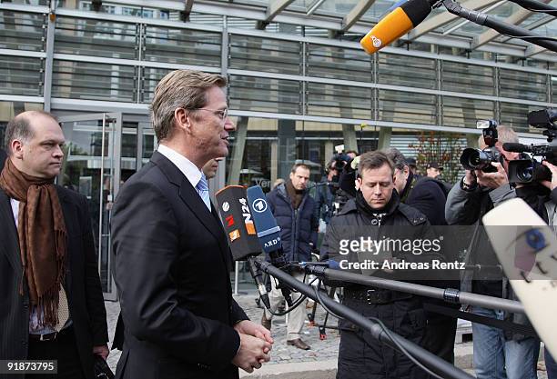 Guido Westerwelle, leader of the German Free Democrats , gives a statement to journalists after the third round of coalition negotiations between the...