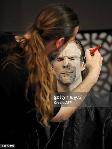 Make up and prosthetic artists from Weta Workshop work with a volunteer during a workshop on the sidelines of the Middle East film festival in Abu...