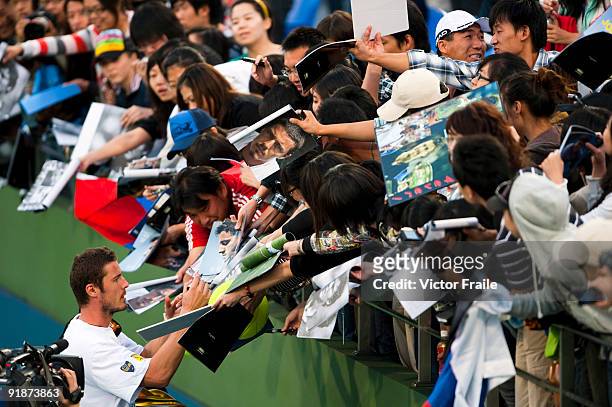 Marat Safin of Russia signs autographs after his match against Tomas Berdych of the Czech Republic during day four of 2009 Shanghai ATP Masters 1000...