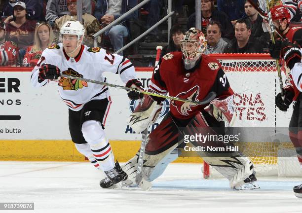 Antti Raanta of the Arizona Coyotes gets ready to make a save while being screened by Lance Bouma of the Chicago Blackhawks at Gila River Arena on...