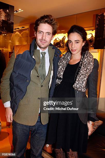 Arthur Kersauson and Luigi d'Urso daughter attend the Cocktail Party at Tods Shops to introduce new book Italian Touch on October 13, 2009 in Paris,...