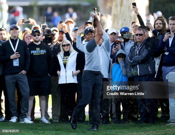 Tiger Woods plays his shot on the 12th hole during the first round of the Genesis Open at Riviera Country Club on February 15, 2018 in Pacific...