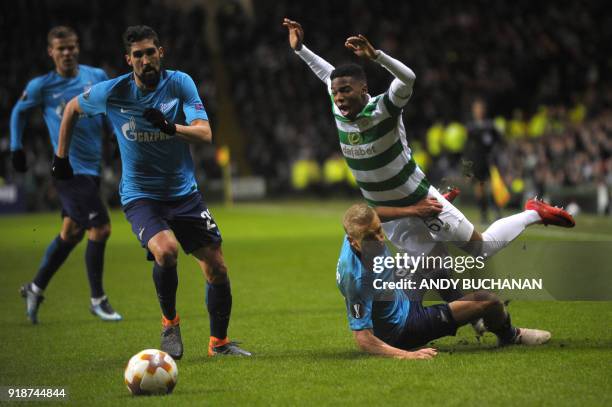 Celtic's Carly Musonda is tackled by Zenit St Petersburg's Russian defender Igor Smolnikov during the UEFA Europa League football match between...