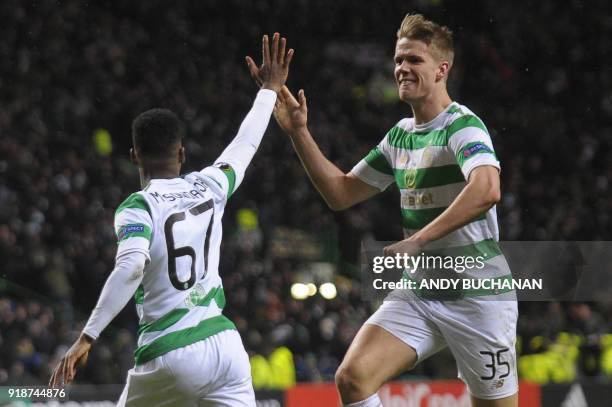 Celtic's Carly Musonda celebrates with Celtic's Norwegian midfielder Kristoffer Ajer at the final whistle during the UEFA Europa League football...