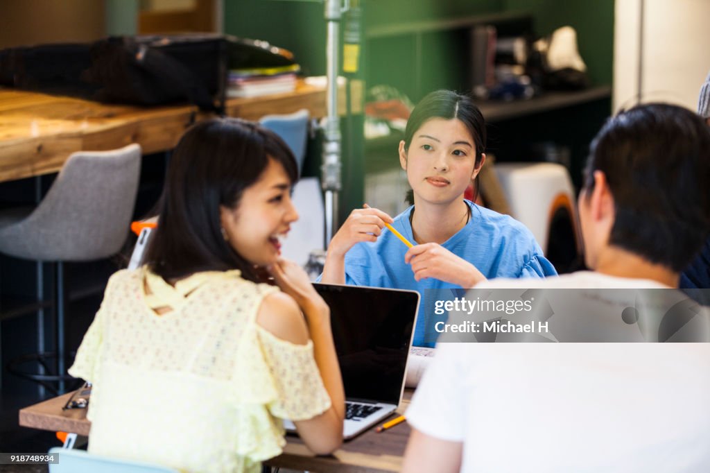 Startup colleagues discussing in meeting