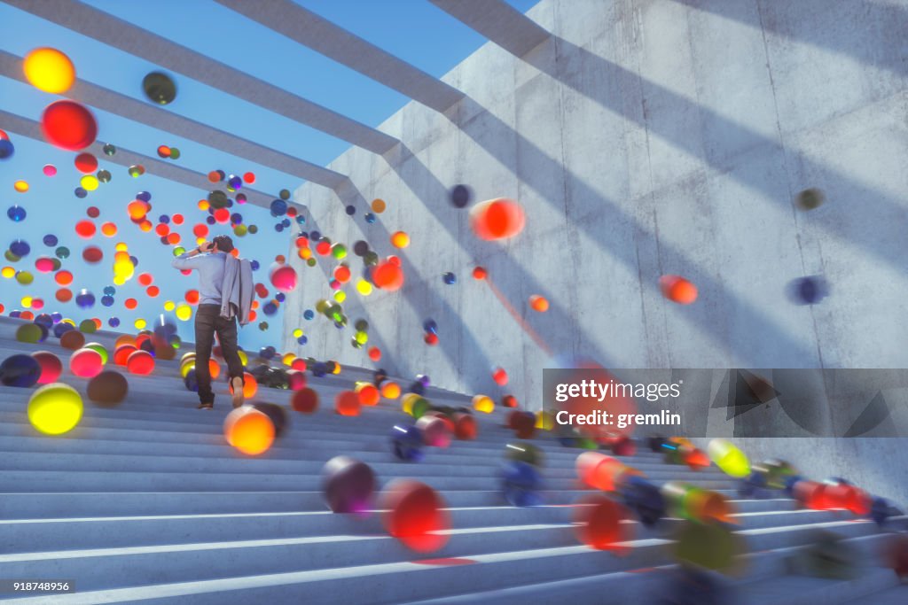 Large group of glowing spheres falling down the urban concrete stairs