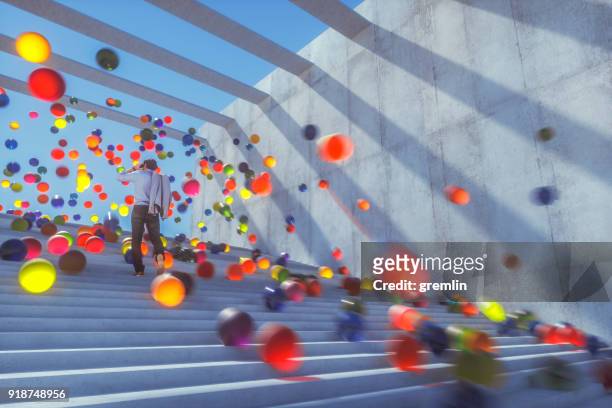 large group of glowing spheres falling down the urban concrete stairs - ball stock pictures, royalty-free photos & images