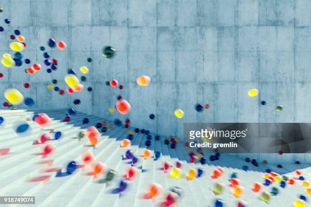 grote groep van gloeiende bollen vallen de stedelijke betonnen trap - bouncing ball stockfoto's en -beelden